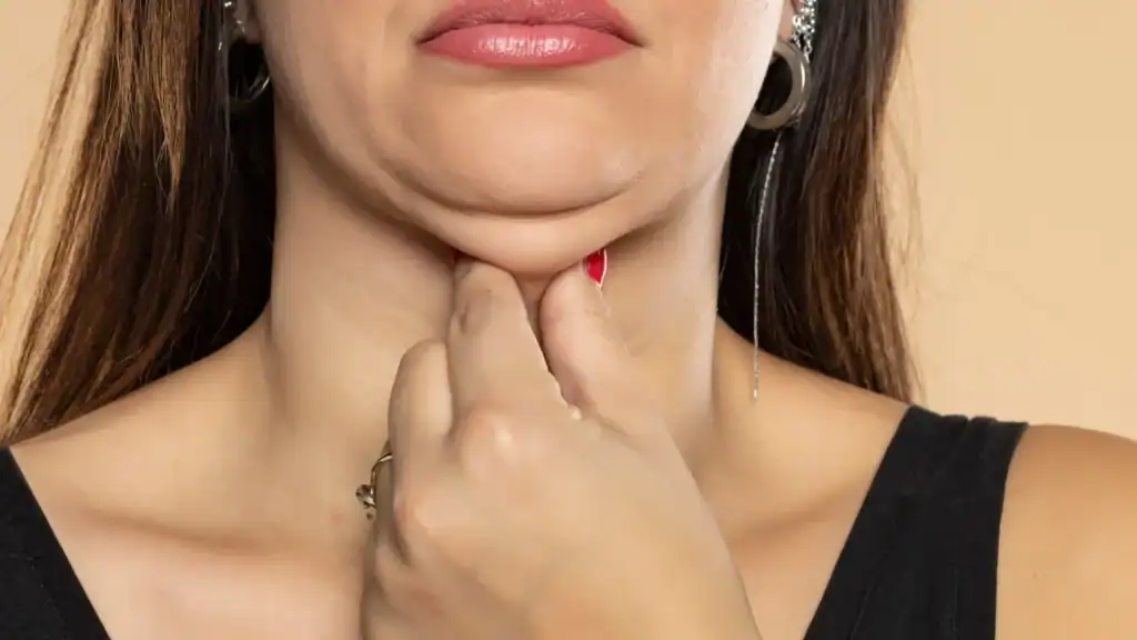 An image of a woman with double chin, sad, worried : Non Surgical Double Chin Removal Treatment in Knowle Grove, UK